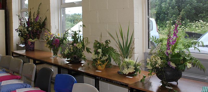 A Selection of the Flower Arrangements on a table