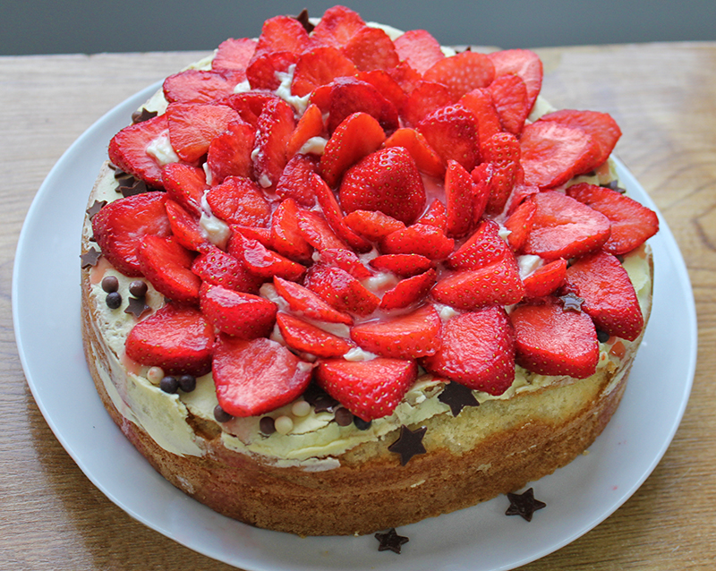 Close up of sliced strawberry decoration on a cake at ICA Wicklow Town