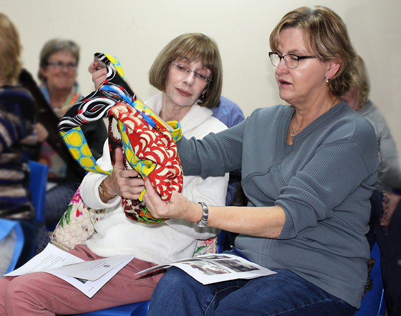 Examining a bag from Malawi