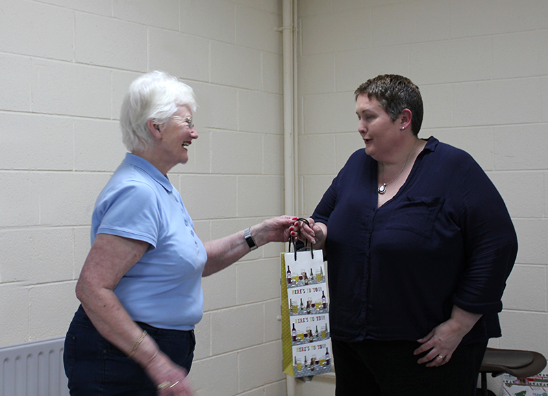 Betty handing a thank you gift to Sinéad after the talk