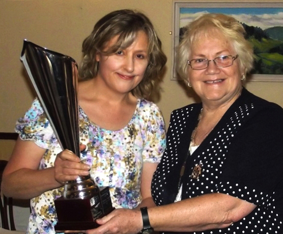 Susanna Braswell receives the Sadie Ryan Trophy for Creative Writing from Madge Kenny, Wicklow Federation President